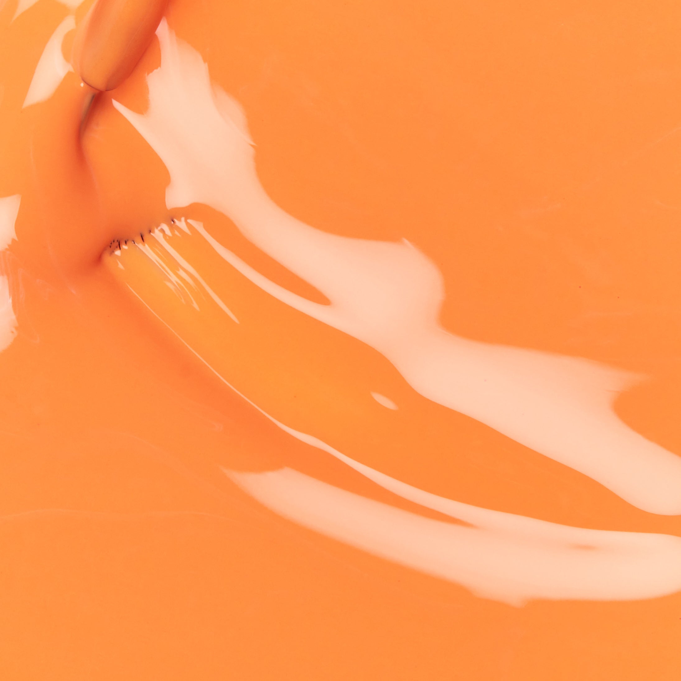 A swatch of the color  SUN OF A PEACH.
