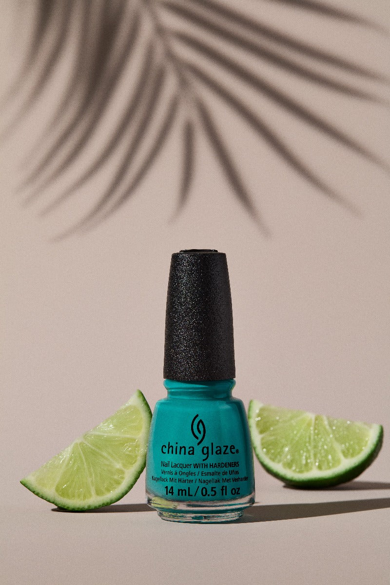 Wide-view of China Glaze Head to Moji-Toes nail color container  with ripe citrus behind